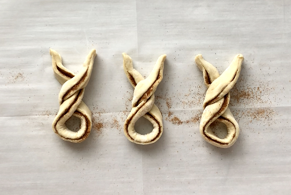 Cinnamon sugar filled pastry strips twisted together to form bunny shape