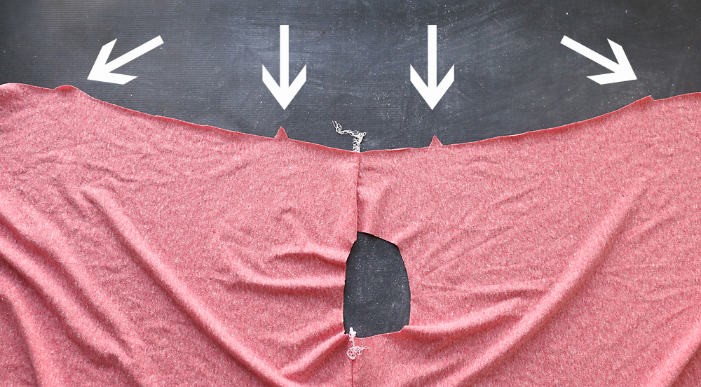 Shirt open at shoulder seam, notches marked