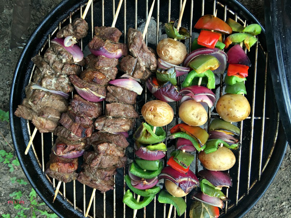 Beef and vegetable kabobs on a grill