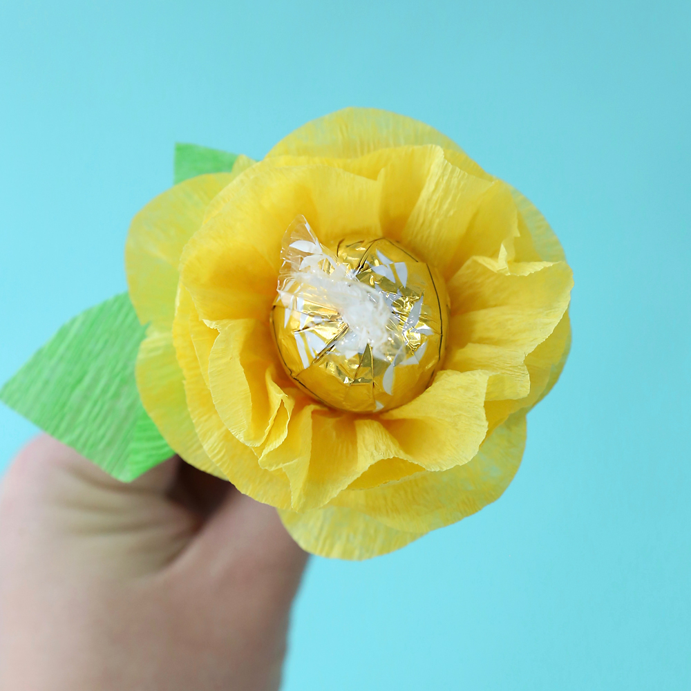 A paper flower with a lindor truffle in the center