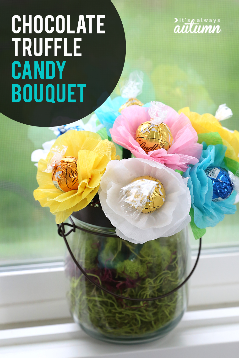 A vase with flowers made from chocolate truffles and paper