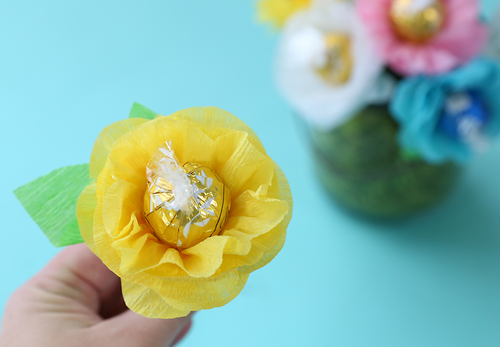 Hand holding chocolate truffle flower