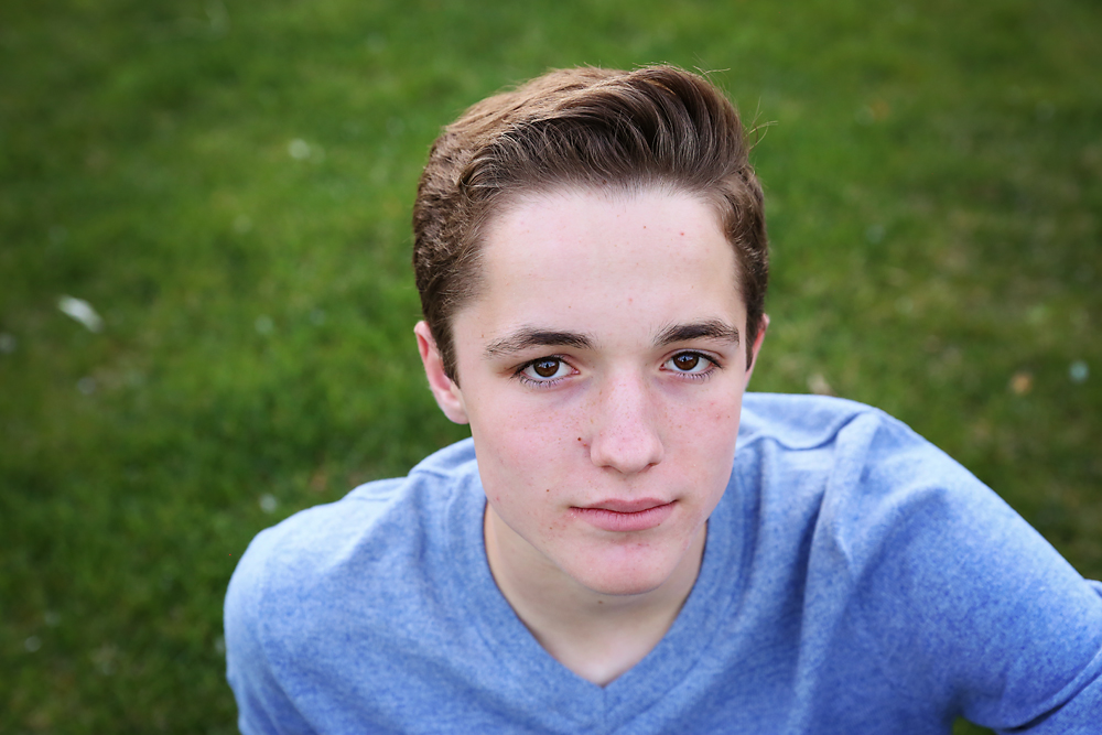 A young boy in a blue shirt