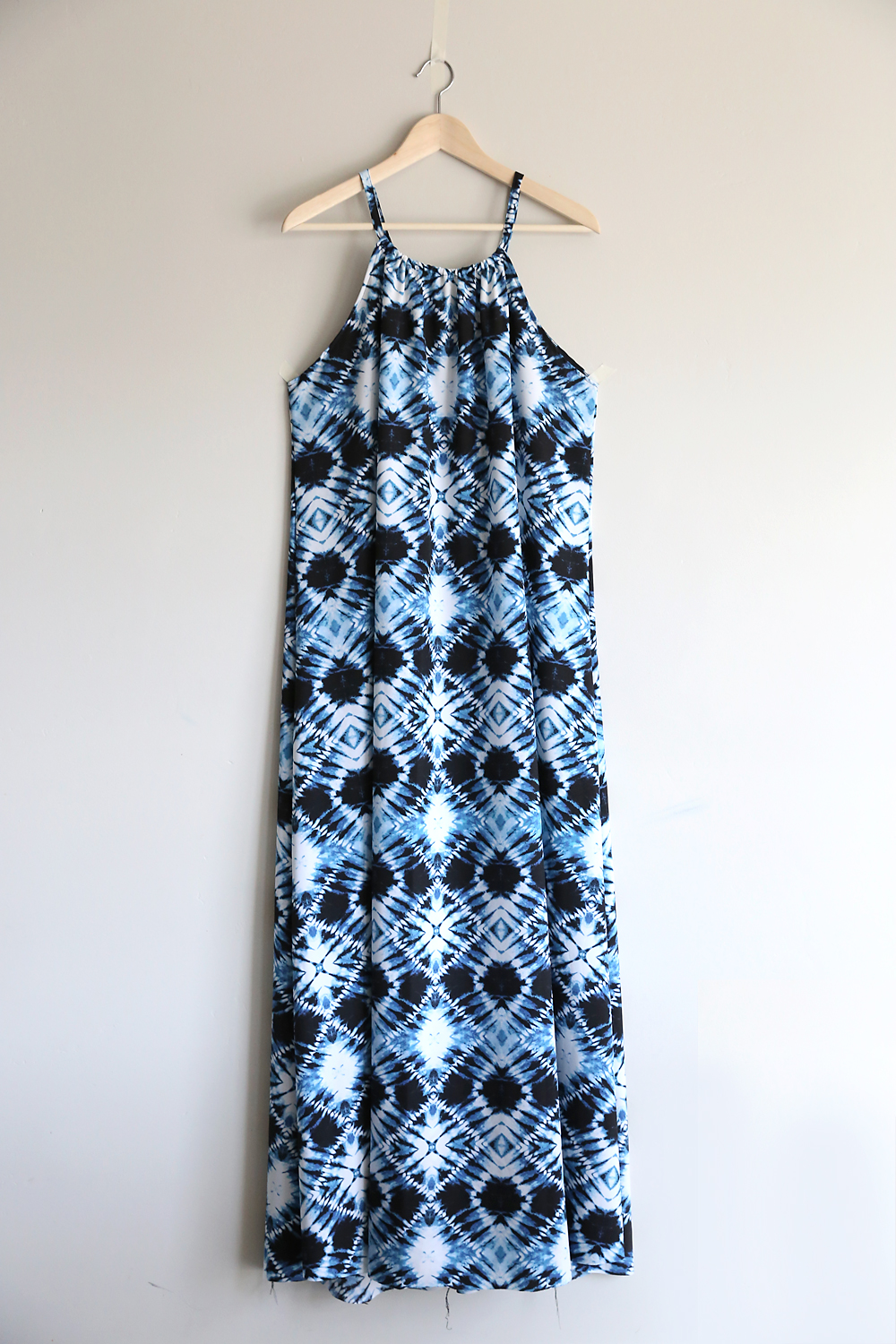 Halter top maxi dress hanging on a hanger