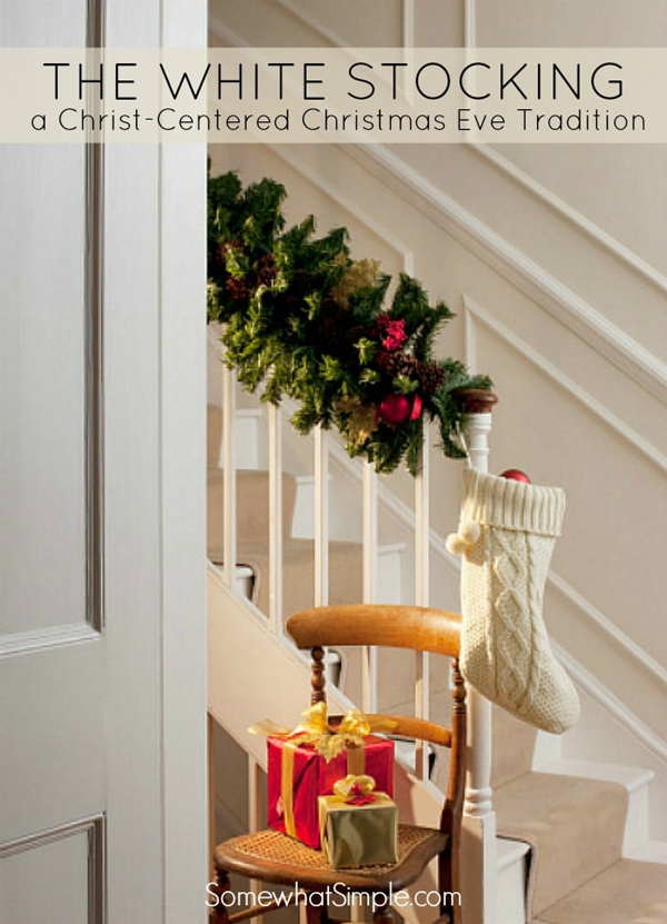 White stocking hanging from the end of a decorated banister - Christmas Eve tradition