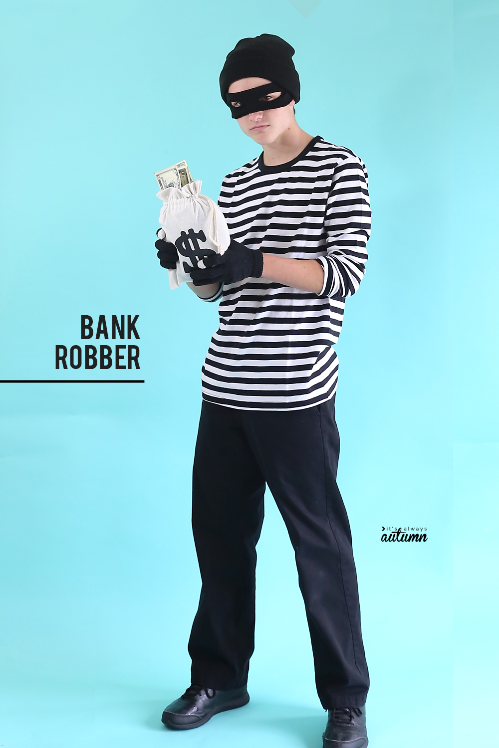 Teen boy dressed in bank robber Halloween costume