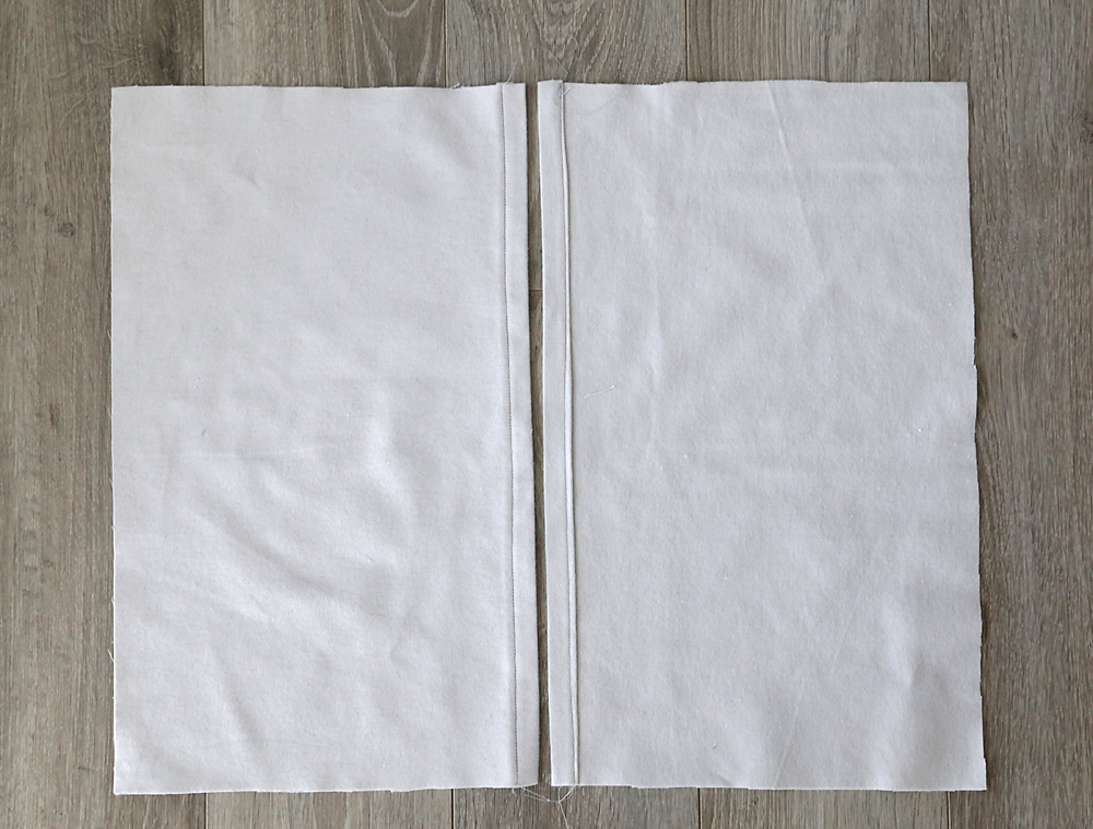 Two backing fabric pieces, each hemmed along one edge