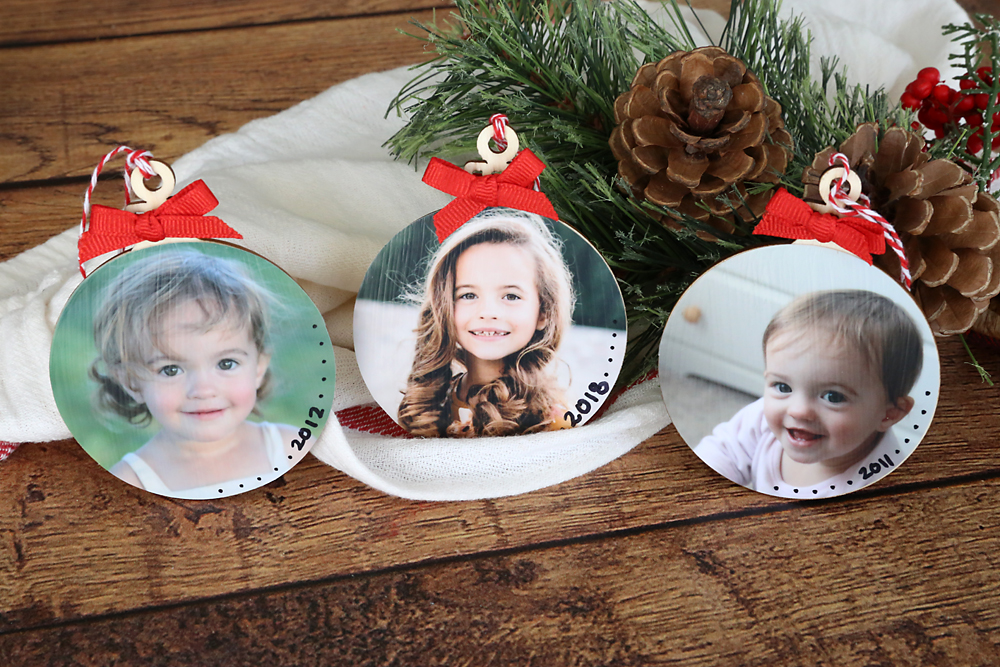 DIY photo ornaments with pictures of a little girl, one for each year