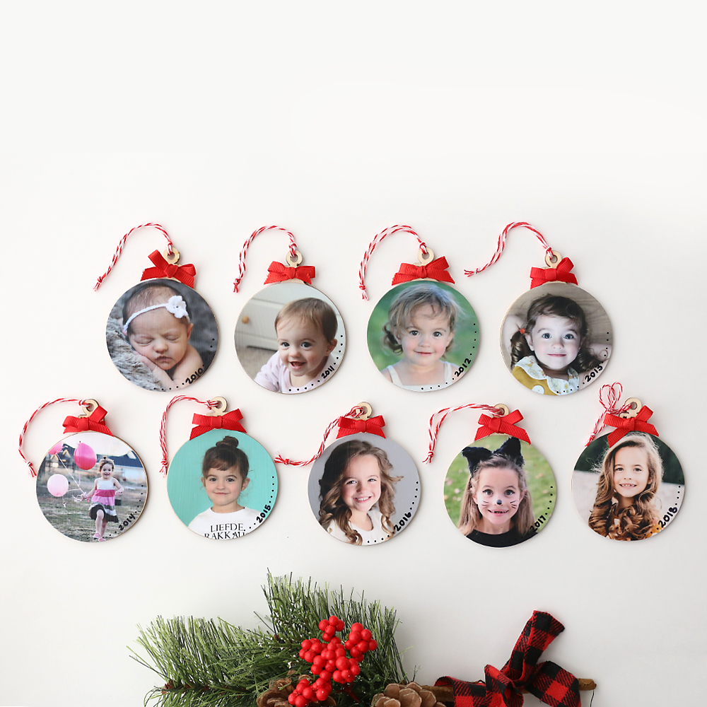 DIY photo ornaments with pictures of a little girl, one for each year