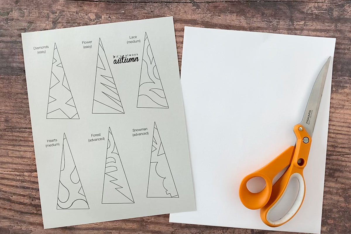 Paper snowflake templates; copy paper; scissors