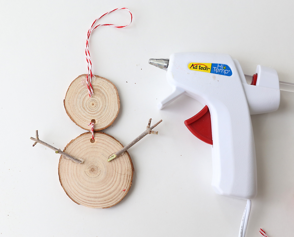 Wood slices with sticks glued on to make arms