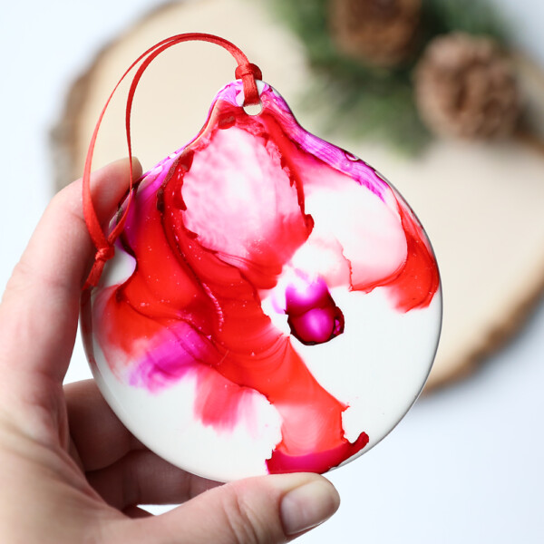 These pretty marbled Christmas ornaments are made with alcohol ink and FIRE! Great Christmas craft idea for kids.