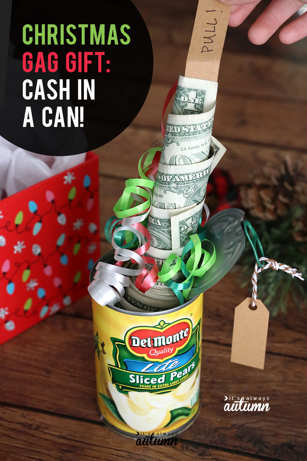 Christmas cash in a can gift, with roll of money coming out of a can of pears