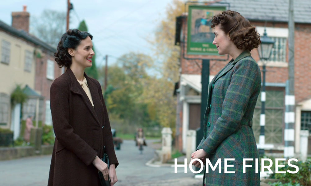 Two women talking in the street in the movie Home Fires