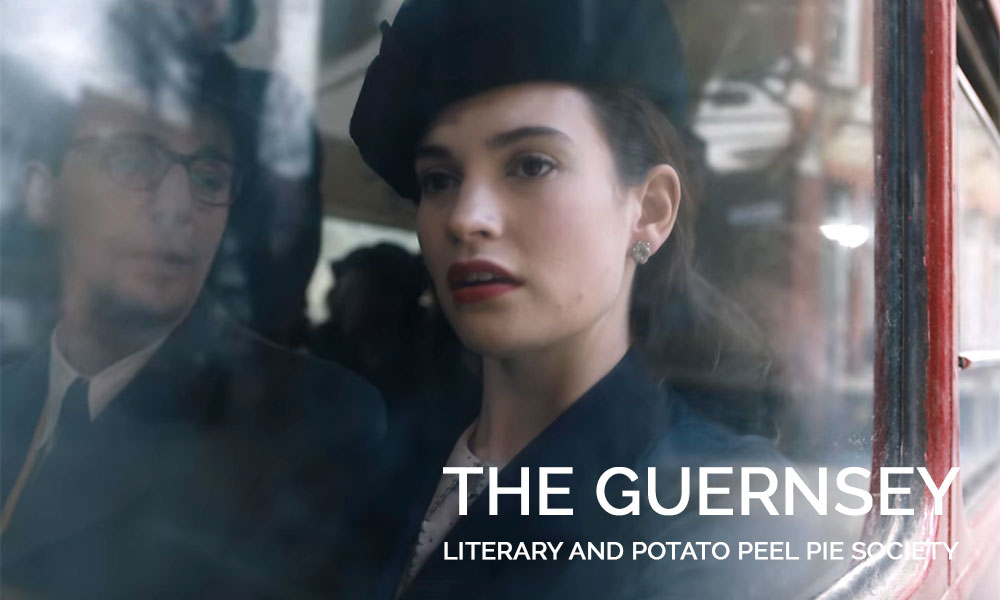 A close up of Lily James wearing a hat in The Guernsey Literary and Potato Peel Pie Society