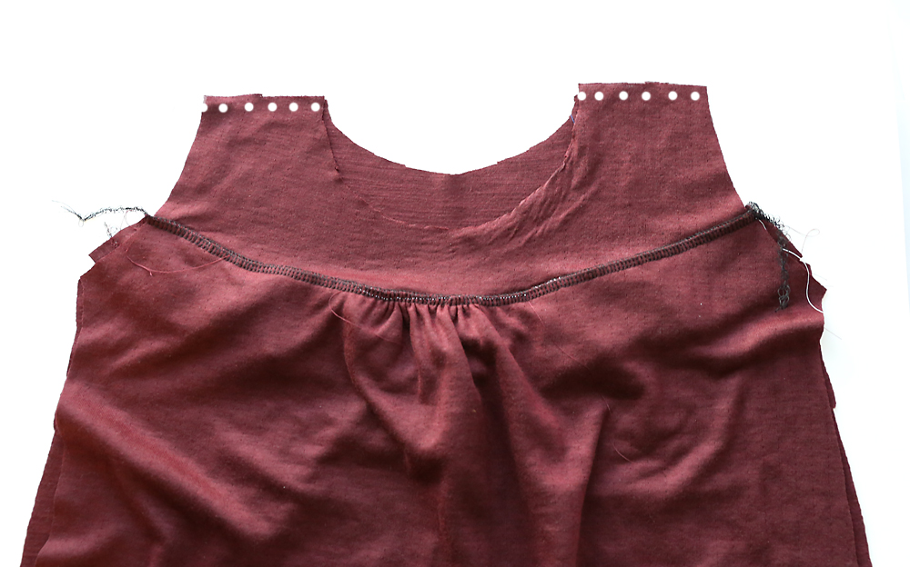 Shirt pieces sewn along shoulders