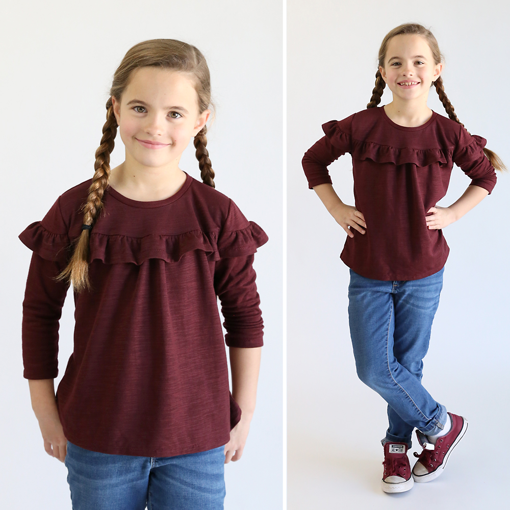 Girl wearing ruffled t-shirt made from free sewing pattern