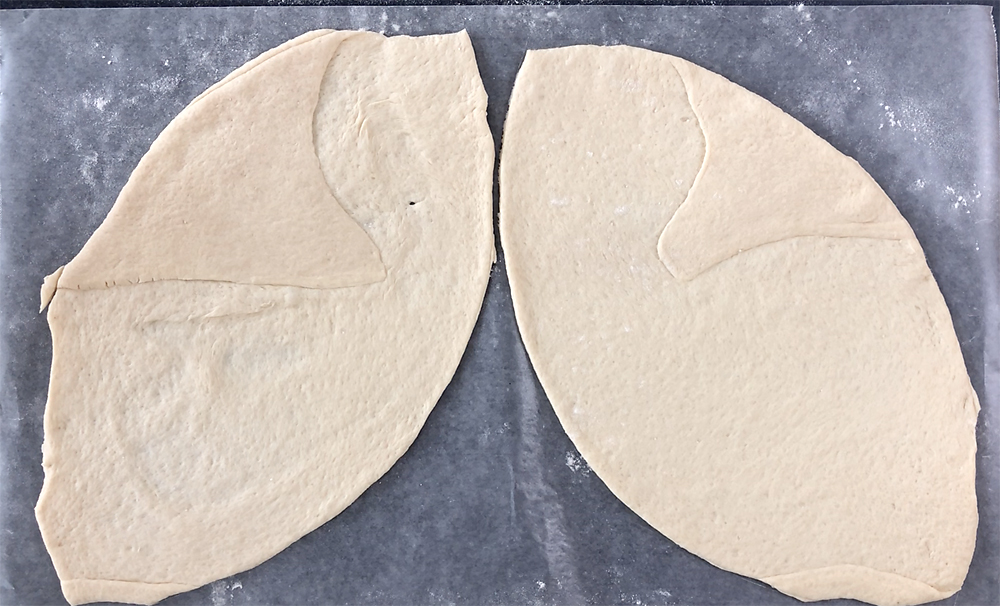 Football shapes cut from pizza dough
