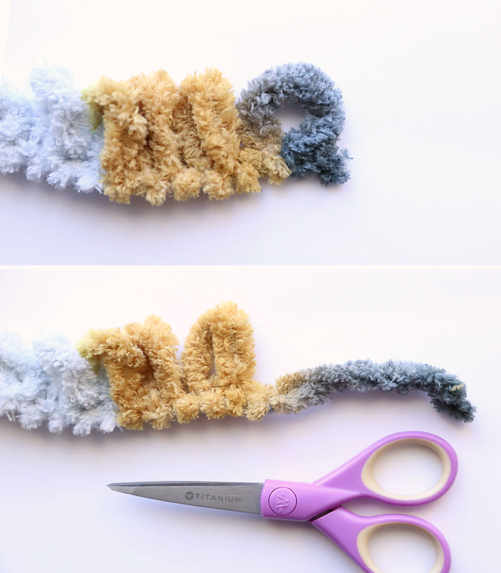 Pair of scissors has cut open the last loop on a length of loop yarn