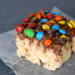 These loaded M&M rice krispie treats are delicious! Extra chewy and full of chocolate flavor. Click through for the easy recipe.