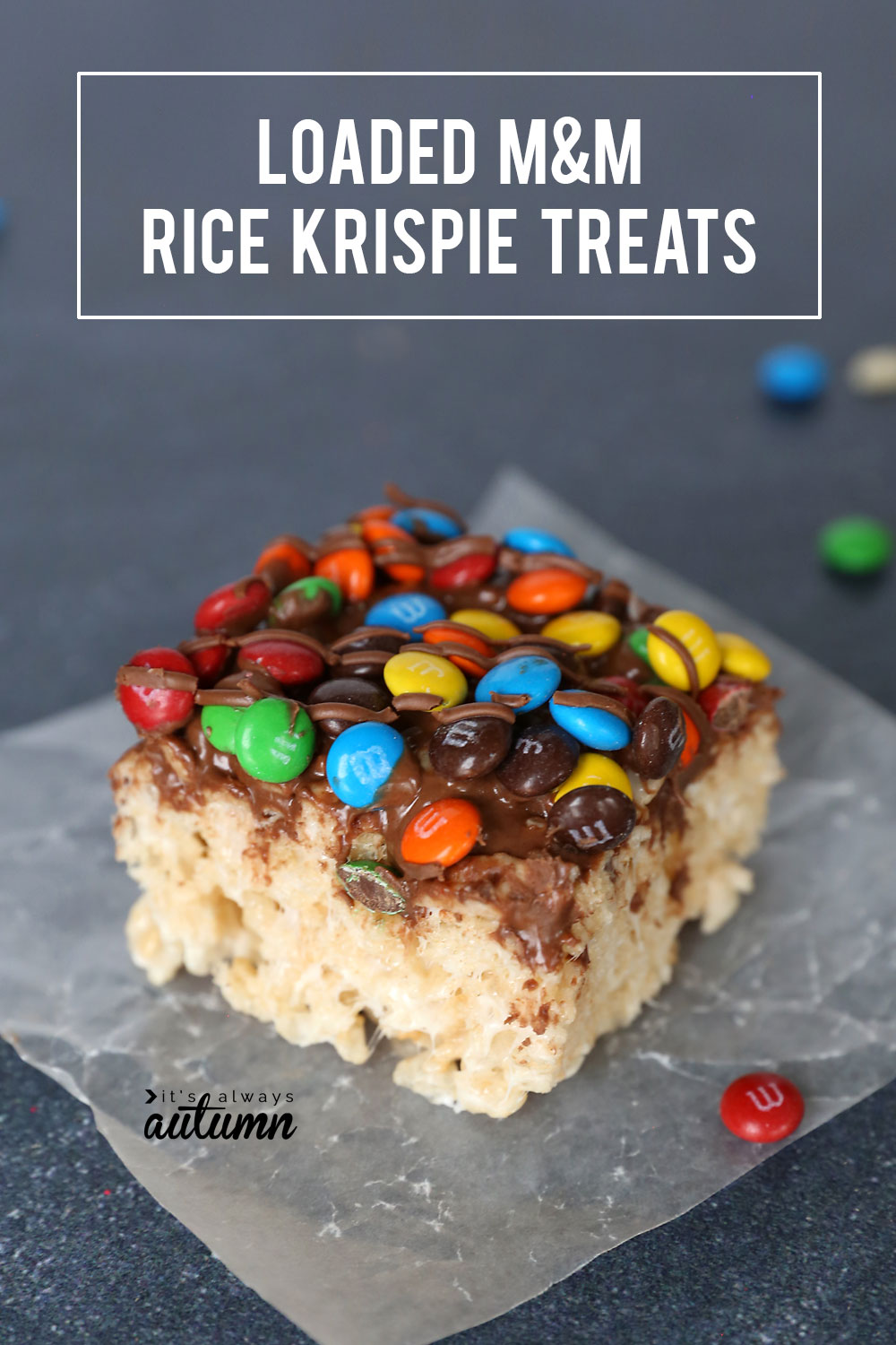 Rice Krispie treats covered in mini M&Ms and chocolate