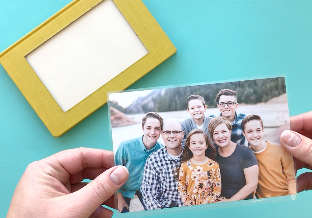 Family photo next to book photo frame