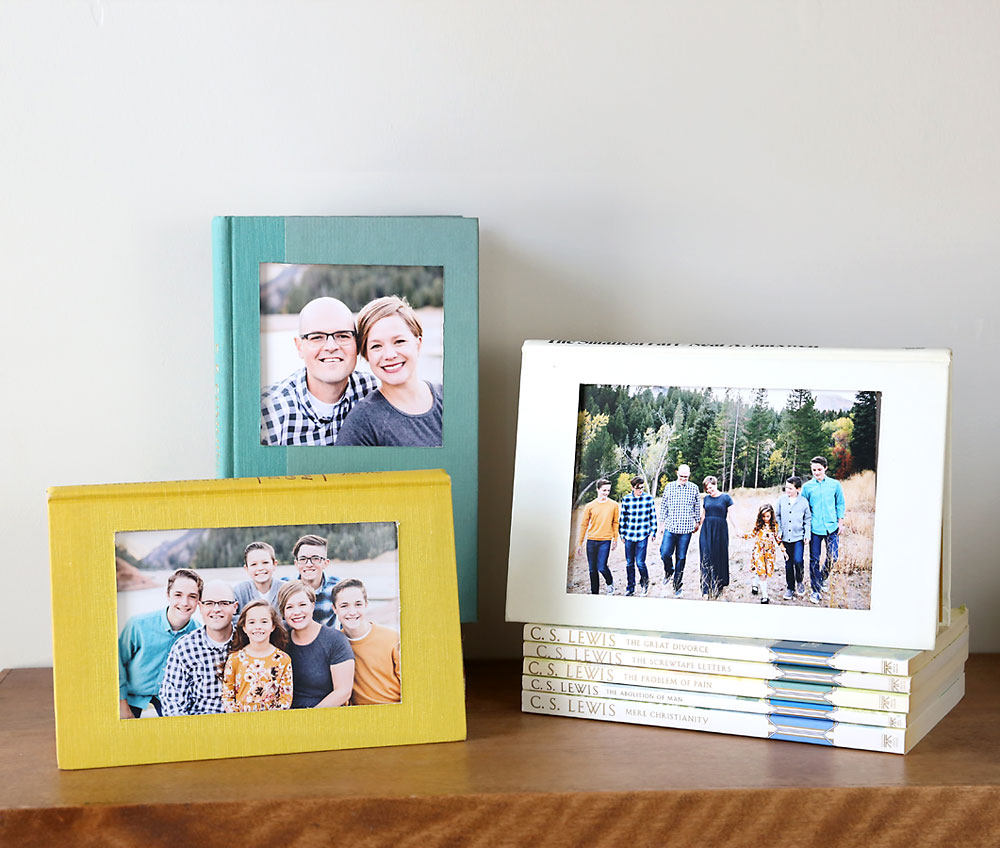 Books with windows cut from the front covers to made photo frames