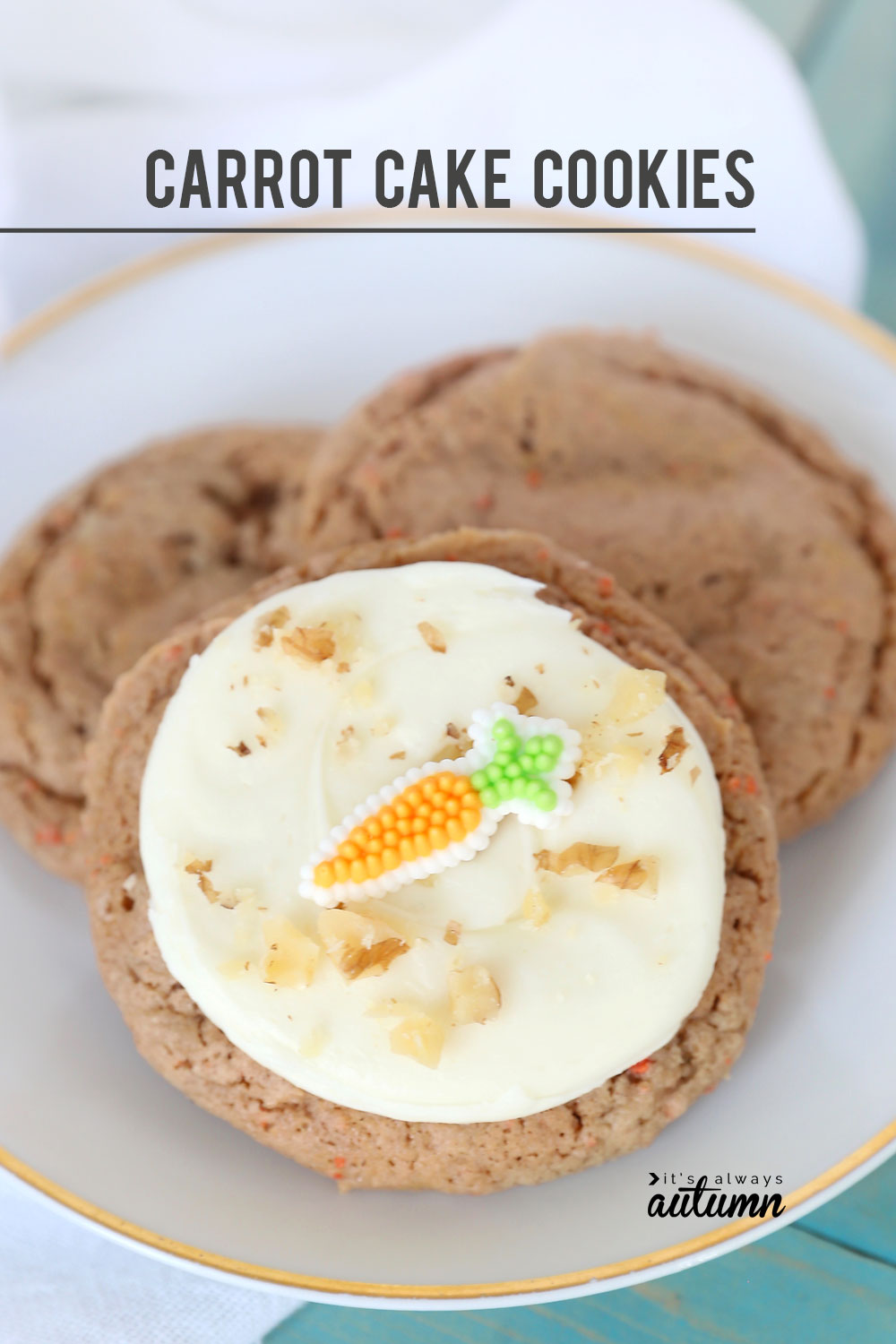 Carrot cake cookie with white frosting and carrot candy