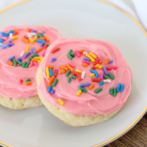 Sugar cookies made from a cake mix with pink frosting and sprinkles