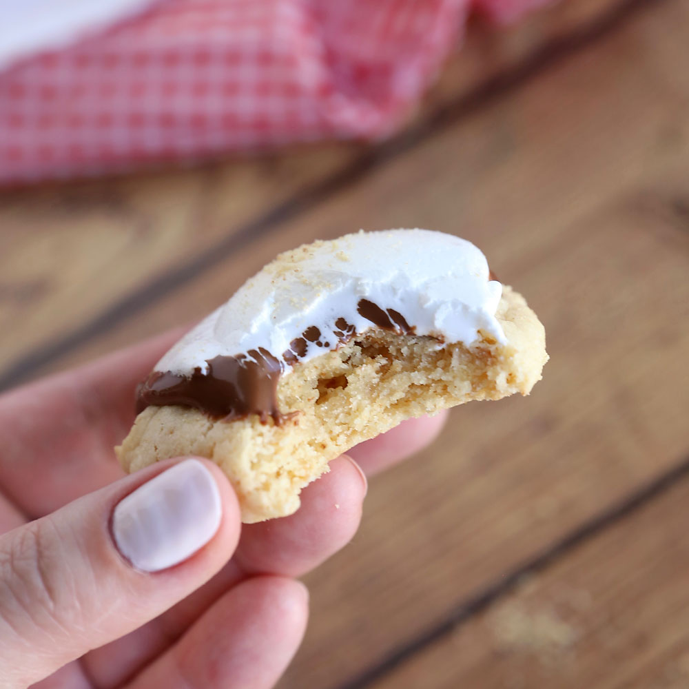 A smores cake mix cookie with a bite taken out of it