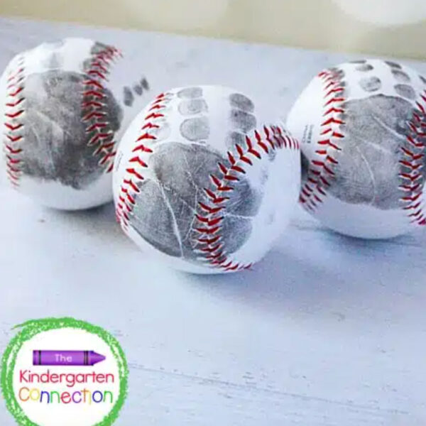 Baseballs with kid's handprint on them.