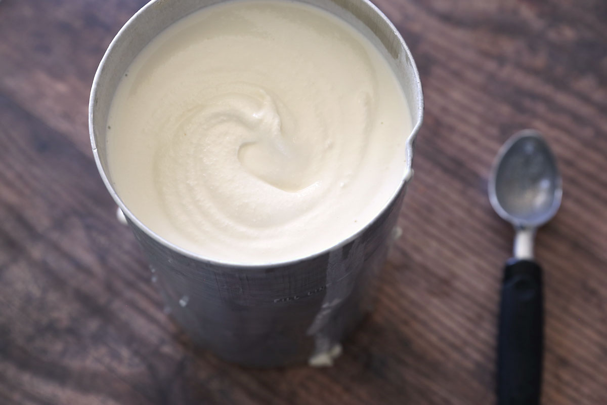 Homemade vanilla ice cream in the bucket of the ice cream maker