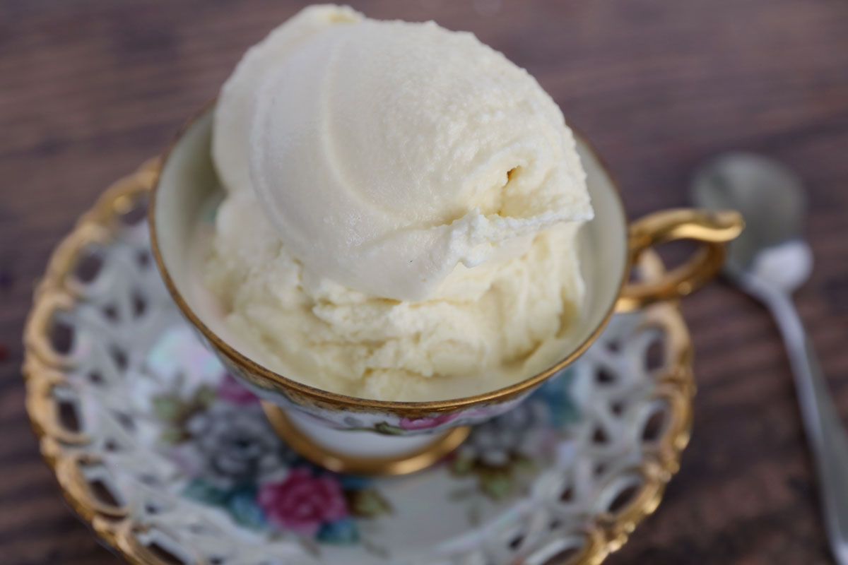 Scoop of old fashioned vanilla ice cream in a teacup