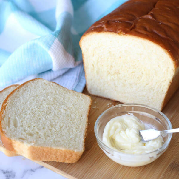 Loaf of bread sliced with butter