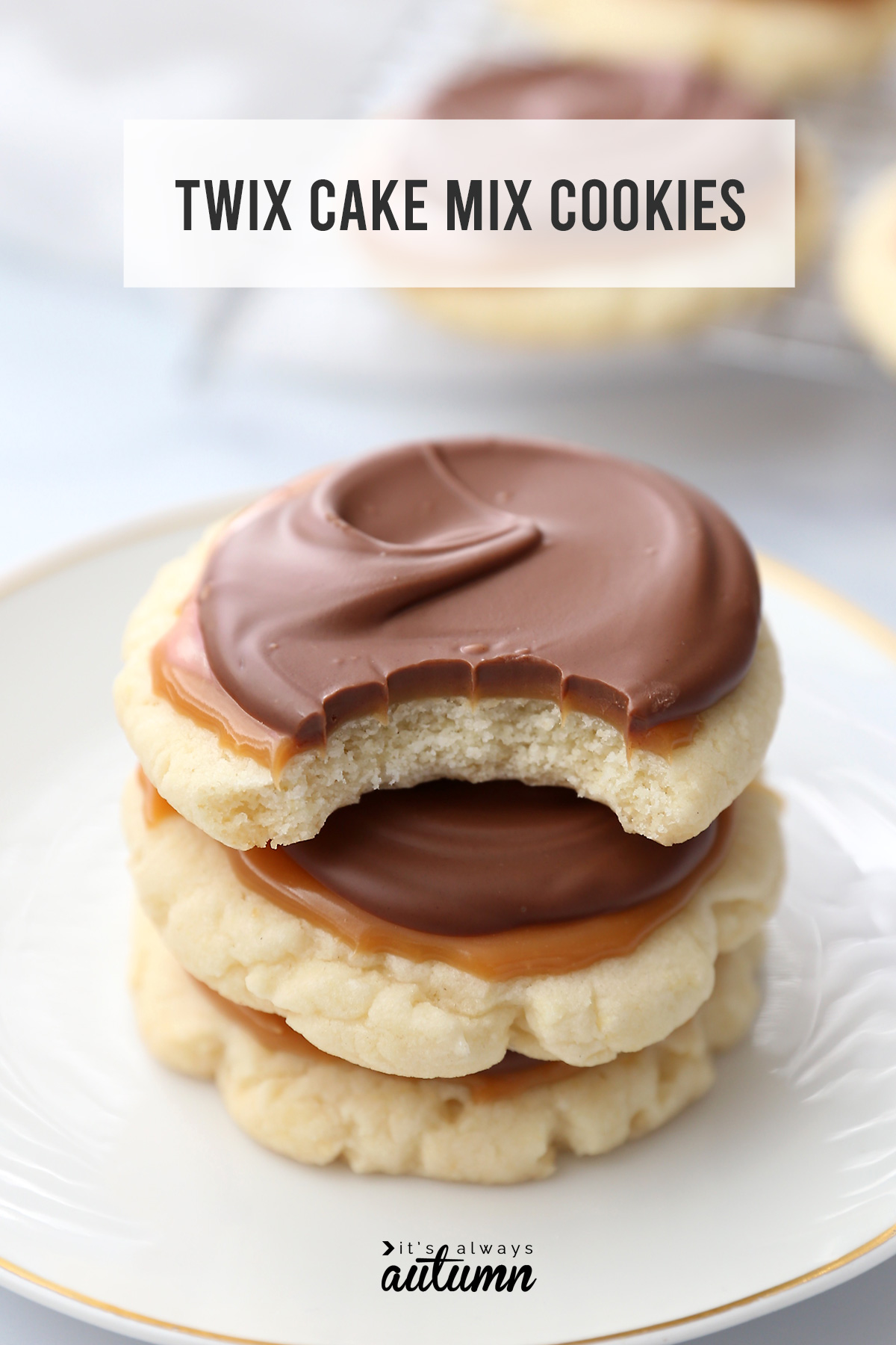 A stack of Twix cake mix cookies with a bite taken out of the top cookies