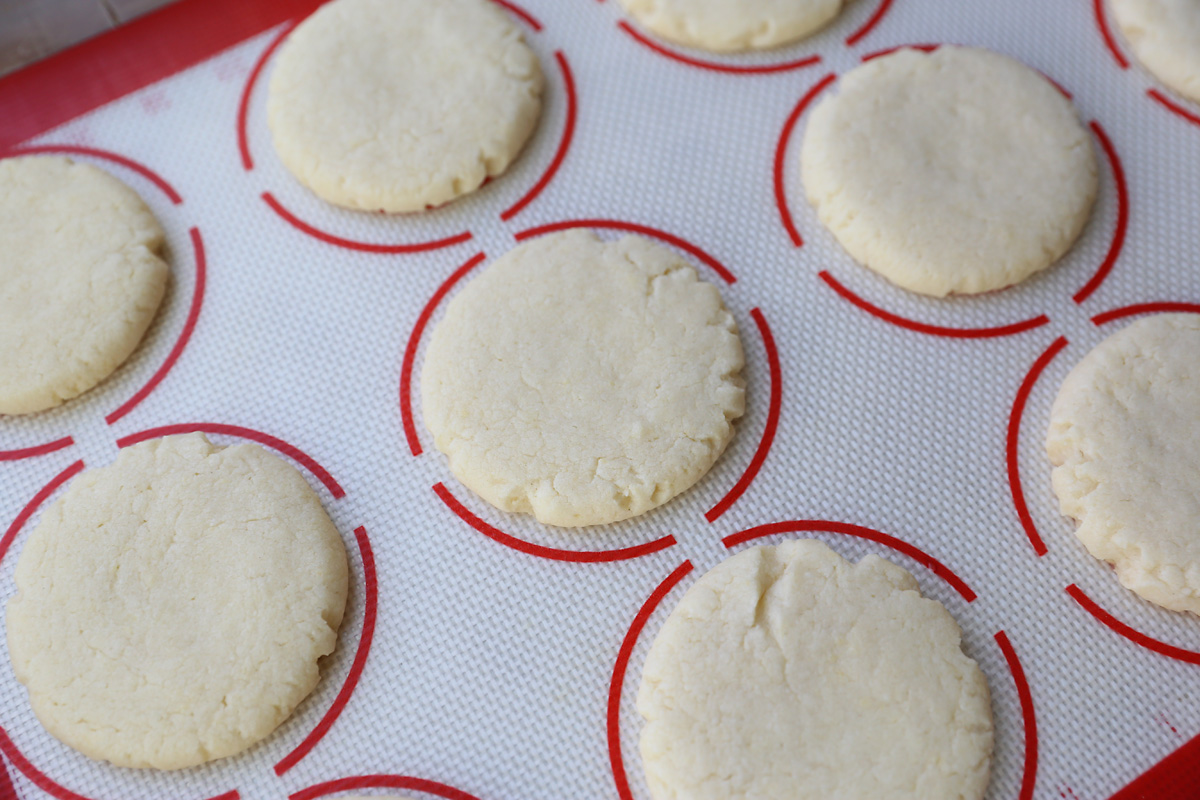 Baked sugar cookie on a cookie sheet liner