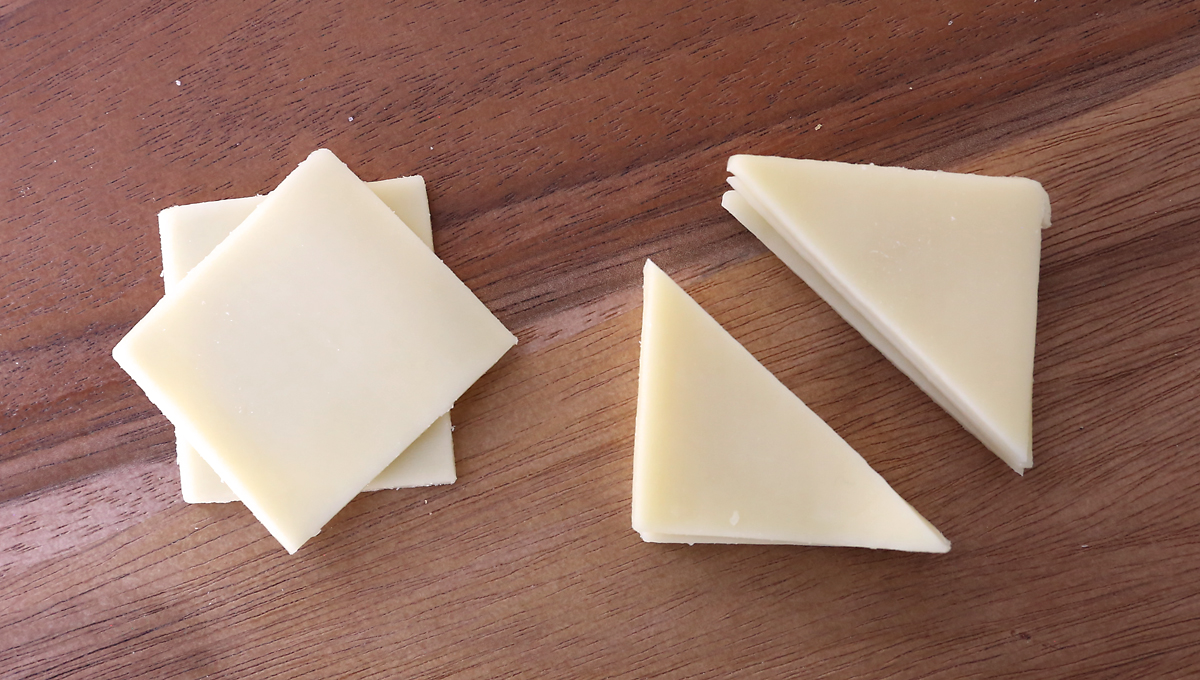 Cheese squares cut diagonally into triangles