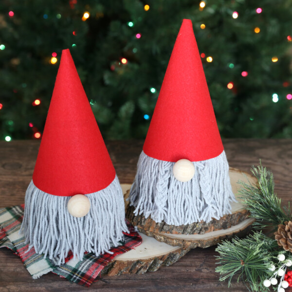 Christmas gnomes made from toilet paper roll with yarn beard and red felt hat