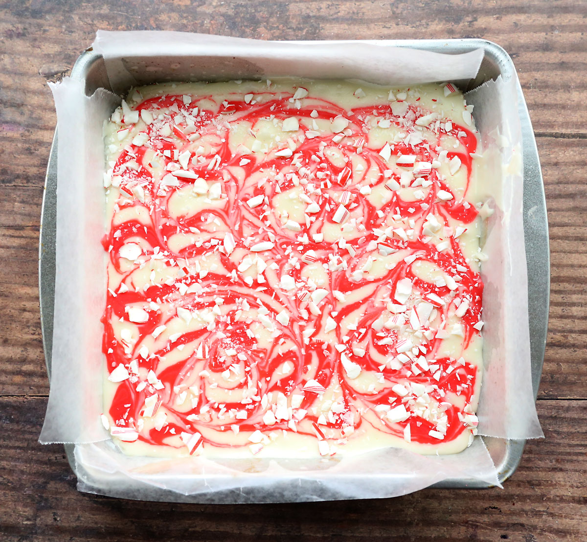 Lined 9x9 pan filled will peppermint bark fudge