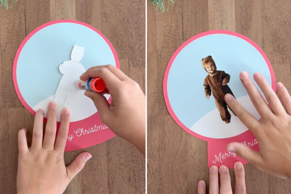 Gluing photo of child in center of snowglobe.