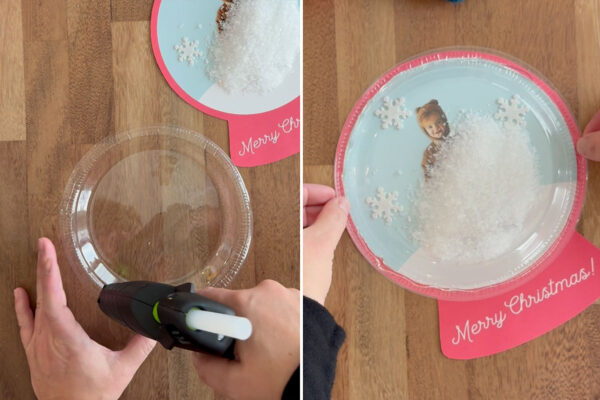 Using hot glue to attach plate to snowglobe.