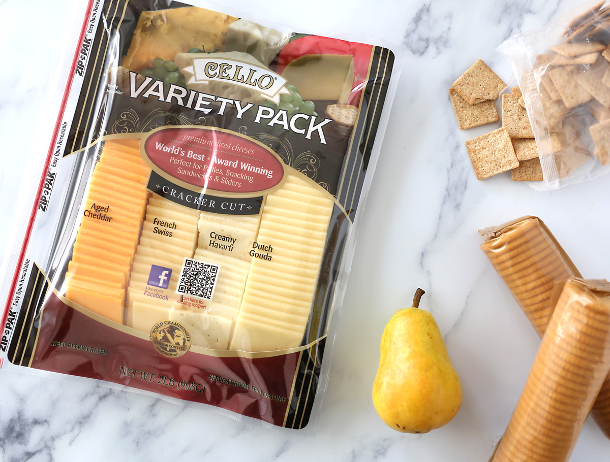 Variety pack of cheese with crackers and pear
