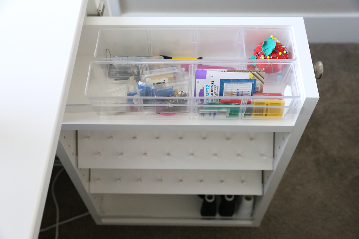 Slide out drawers of the Sew Station filled with sewing notions