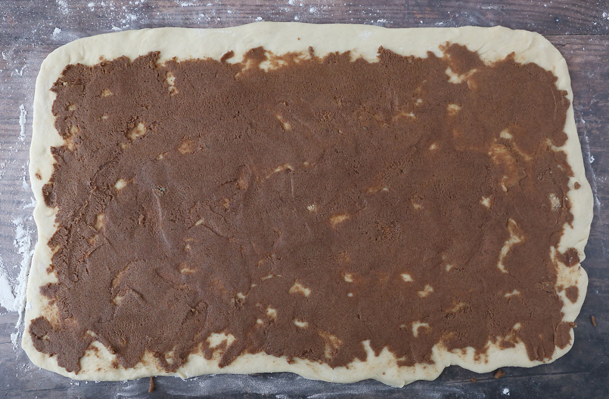 Cinnamon sugar filling spread over dough