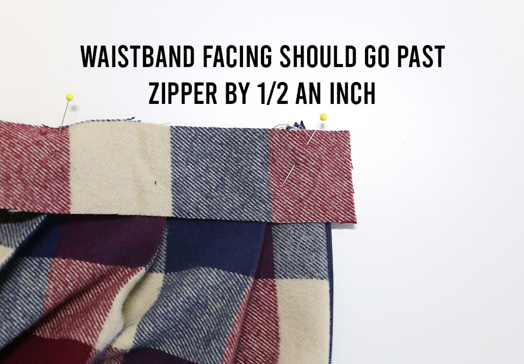 Waistband facing extends past zipper by 1/2 an inch