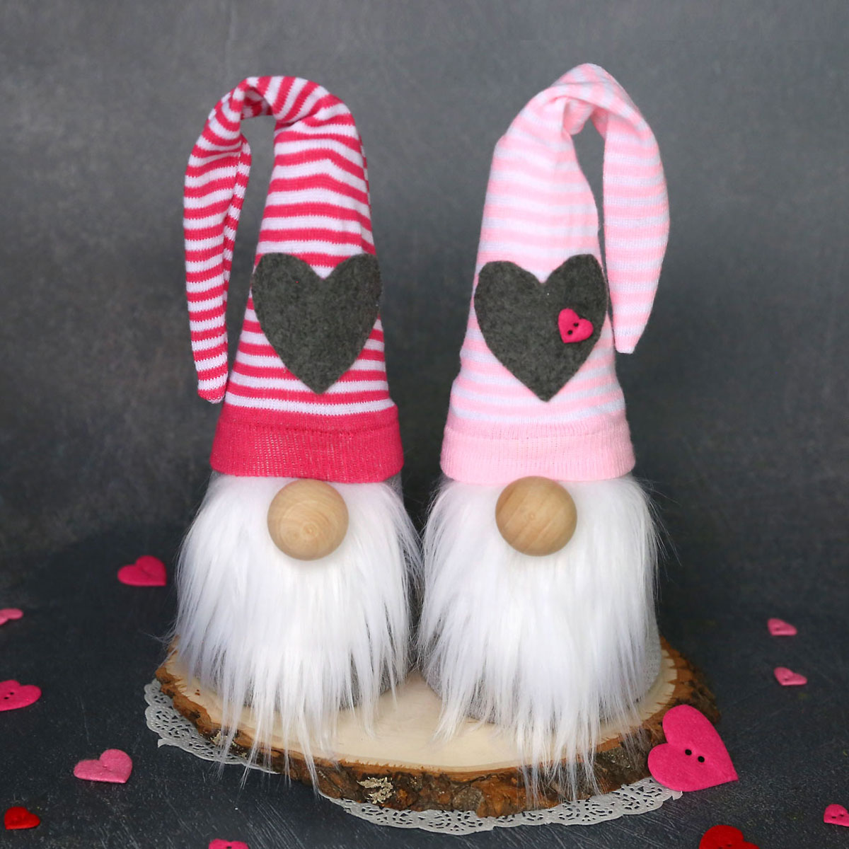 Two sock gnomes with pink striped hats with hearts on them for Valentine\'s Day