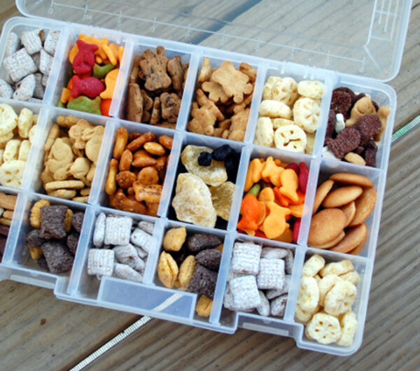 Plastic tacklebox filled with snacks.