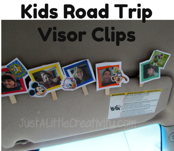 Pictures of kids clipped up on a car visor.