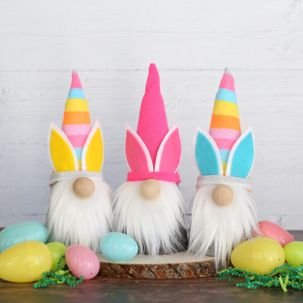 Three DIY gnomes wearing colorful Easter bunny hats