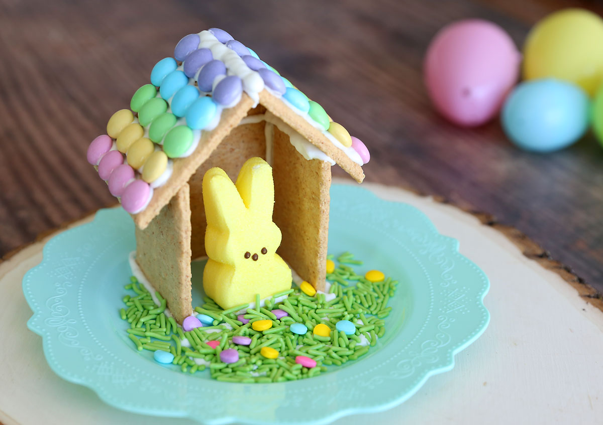 House for an Easter bunny Peeps made from graham crackers and frosting, on a plate